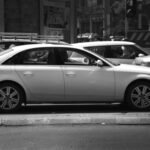 a black and white photo of a busy street